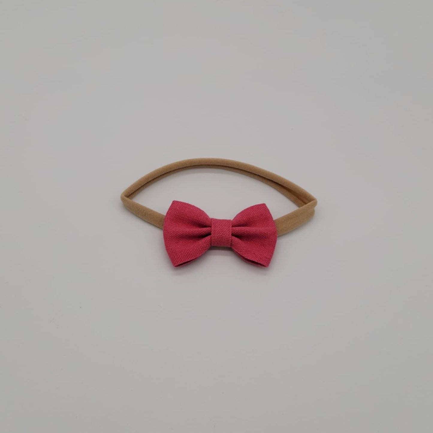 Nylon headband small bow fucsia