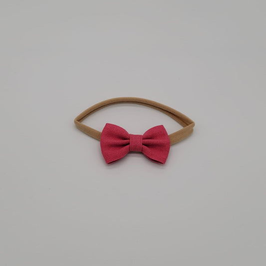 Nylon headband small bow fucsia